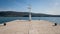 Pier with lighthouse and bollards in the harbour of Cres