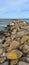 A pier made of large stones in the Baltic Sea