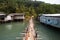 Pier made of wooden planks in the fishing village on Ko Chang island, Thailand. Nature.