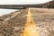 Pier marking yellow safe line edge sea perspective view panorama sunny day