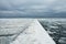 pier in the middle of the frozen sea.