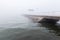 A pier in the midst of fog