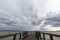 Pier and moody sky