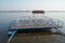 A pier near the coast in the early morning, where river gulls spend the night.