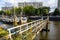 Pier over city river with sailboats, background, wallpaper.