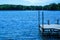 Pier overlooking the blue waters of Sawyer Lake in Norther Wisconsin