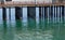 Pier Pillars into Green Sea