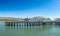 pier in Santa Barbara - Stearns wharf - with empty beach in midday heat