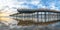 Pier that stretches toward the setting sun, panorama. An iconic California wooden pier at 1, 370 feet long in the heart of Pismo B