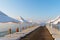 Pier with sunbeds and umbrellas