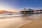 Pier sunset on the beach by the sea