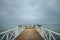 Pier with wooden plank flooring and hammocks to liven up the wait while