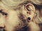 Pierced man ear, black plug tunnel, industrial and rook