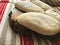 pies made of dough on a wooden board on the background of a woven towel