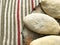 pies made of dough on a wooden board on the background of a woven towel