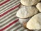 pies made of dough on a wooden board on the background of a woven towel