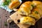 Pies with mushrooms and rice on the kitchen wooden table. Traditional Russian cuisine.