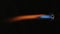 Piezo ignition of a gas burner. A stream of blue orange flame