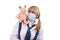 Pig flu virus.Schoolgirl with mask is afraid pig