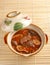 The pig\'s intestines & blood with hot sauce