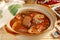 The pig\'s intestines & blood with hot sauce