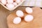 Pigeon eggs on wooden board