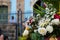 Pigeon among the flowers of a gift to Santa Barbara at Largo do Pelourinho