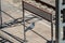 Pigeon standing on a cable with a white empty sign