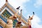 Pigeon stay on naga structure in Wat Sanam henu Temple in Nonthaburi, Thailand.