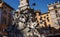 Pigeons in city center of Rome on the fontain