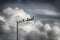 Pigeons, street lamp and beautiful sky with clouds