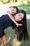 piggy back mother daughter beauty woman pretty girl child in summer lifestyle