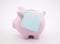 Piggy bank with blank reminder note