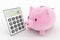 Piggy bank and calculator concept