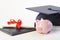 Piggy bank and diploma