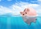 Piggy bank drowning, savings loss concept