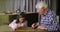 Piggy bank, economy or planning with a girl and her grandfather learning about money, finance or savings. Family, wealth