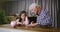 Piggy bank, education or wealth with a girl and her grandfather learning about money, finance or savings. Family