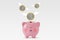 Piggy bank with euro coins flying away - Concept of economy and loss of money