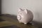 Piggy bank. Figure of pig for folding money. Symbol of financial well-being. Figure of animal is made of porcelain