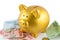 Piggy bank in gold color on bank and coin