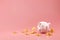 Piggy bank and golden coins on pink background with lost money concept. Financial planning for the future. 3D rendering