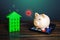 The piggy bank is happy to save on home bills. Save money on utilities and high energy efficiency. Housing green technologies.