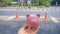 Piggy bank isolate in empty city foot-walk, saving money for spending in emergency or crisis pandemic