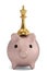 Piggy bank and a king chess piece over white background 3D illustration