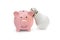 Piggy bank with light bulb on white. Saving energy