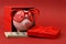 Piggy bank in love with red heart sunglasses standing in gift box with ribbon and with stack of money american hundred dollar bill