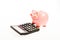 Piggy bank money savings. Piggy bank pig and calculator. Credit debt concept. Economics and profit management. Economics
