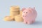 Piggy bank near stack of coins. Financial concept