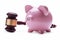 Piggy bank next to a wooden judge gavel